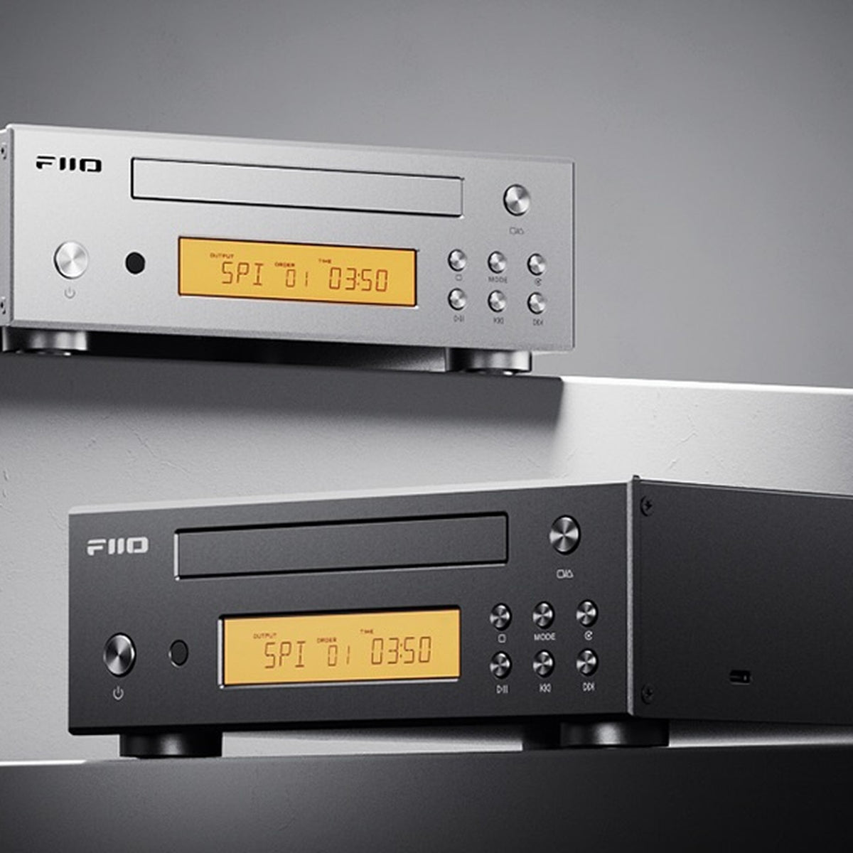 FiiO DP11 in silver and black on a grey shelf