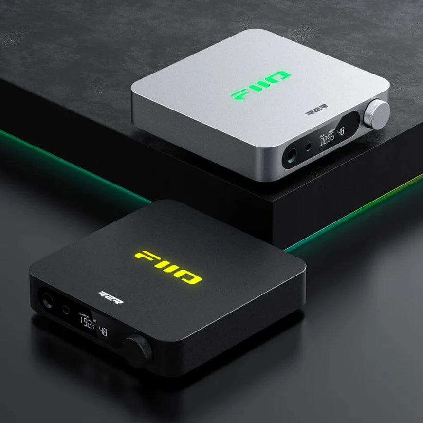 FiiO K11 R2R desktop headphone amplifier and DAC with multiple input ports and a sleek black finish.