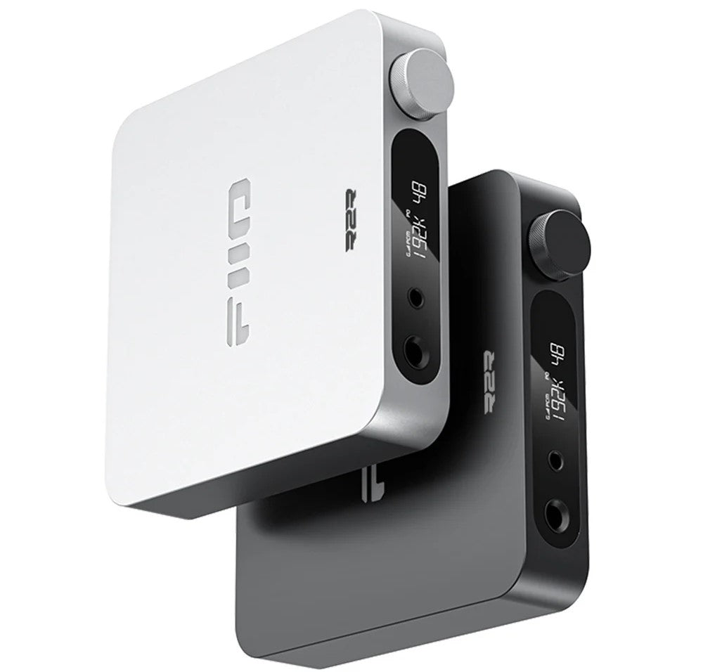 FiiO K11 R2R headphone amplifier and DAC with sleek black design and multiple input ports for high-quality audio output.