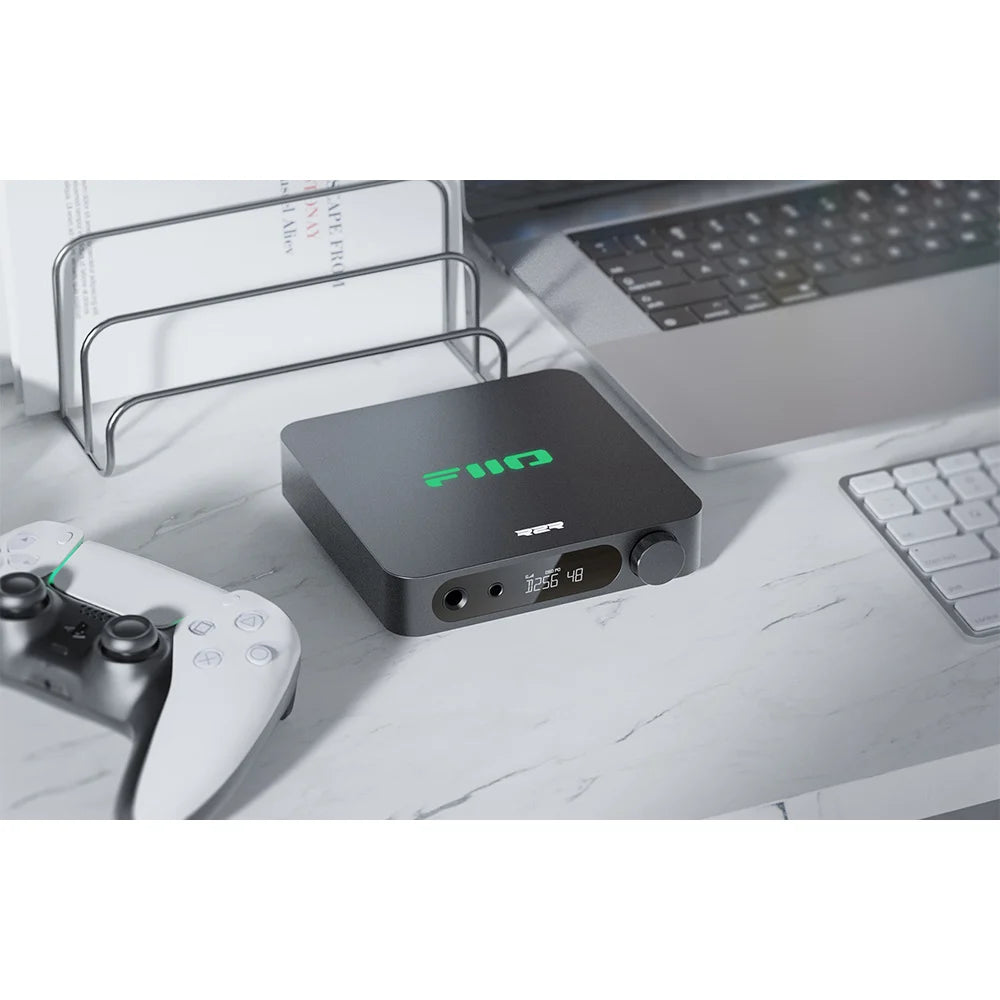 FiiO K11 R2R headphone amplifier and DAC with sleek black design and multiple input ports for high-quality audio output.