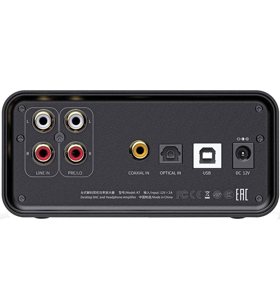 FiiO K7 headphone amplifier and DAC showing front panel with multiple input ports and volume controls.