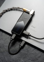 FiiO KA17 headphone amp / DAC, close-up with USB-C cable attached