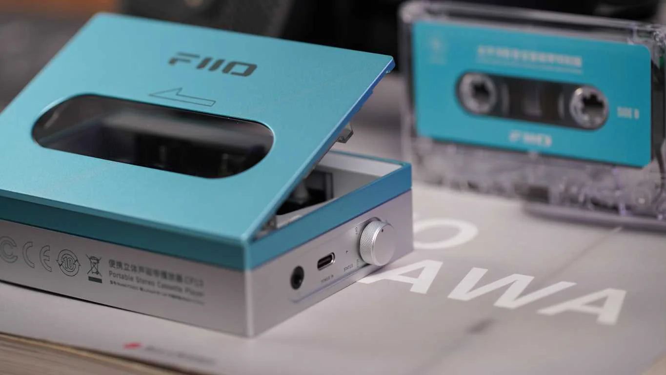 FiiO CP13 portable music player with sleek black design and touchscreen display, showcasing controls and headphone jack.