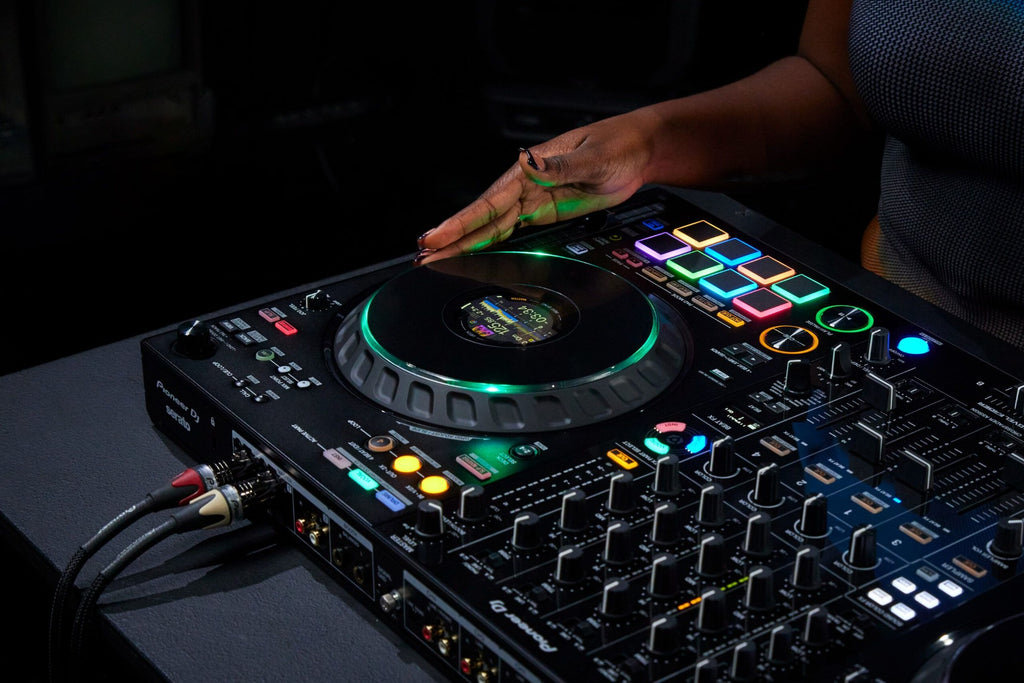 Pioneer DJ DDJ-FLX10 DJ controller with large jog wheels, professional mixer controls, and colorful LED pads for mixing music.