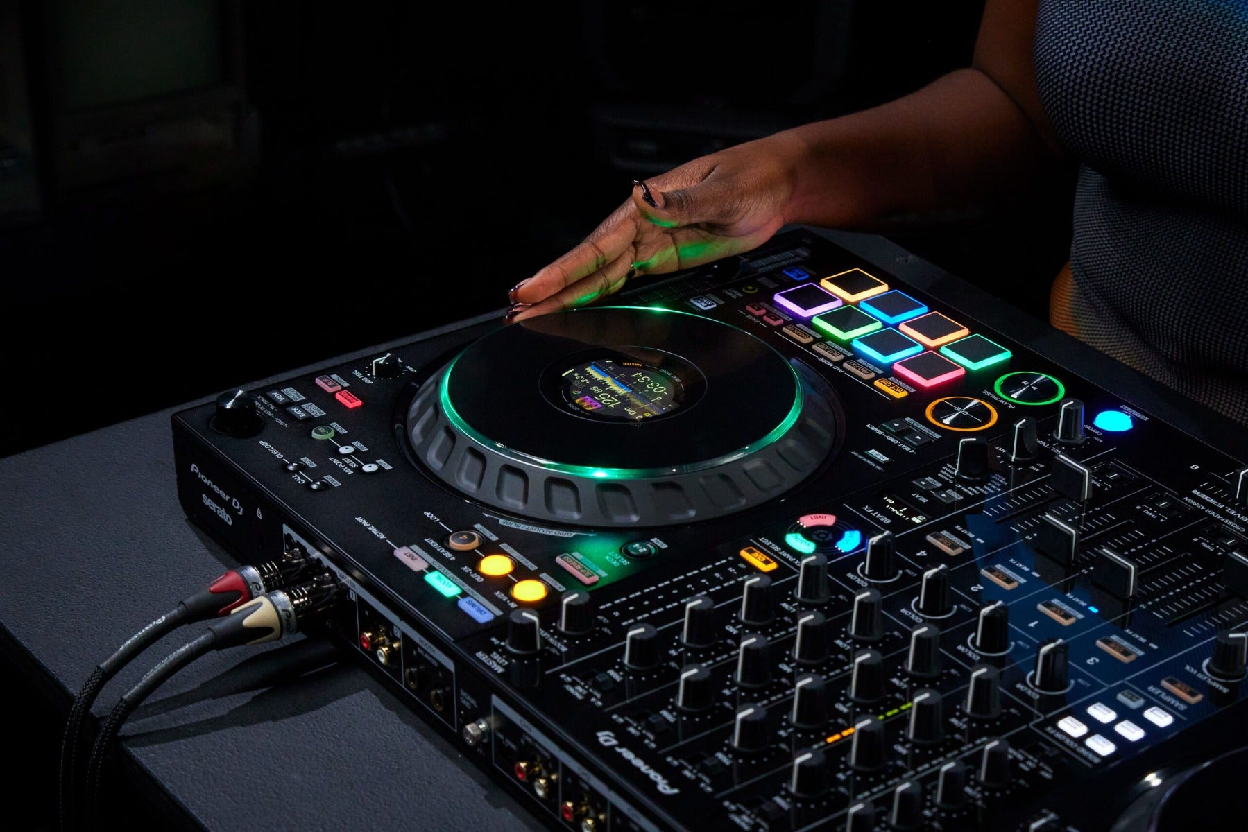 Pioneer DJ DDJ-FLX10 DJ controller with large jog wheels, professional mixer controls, and colorful LED pads for mixing music.