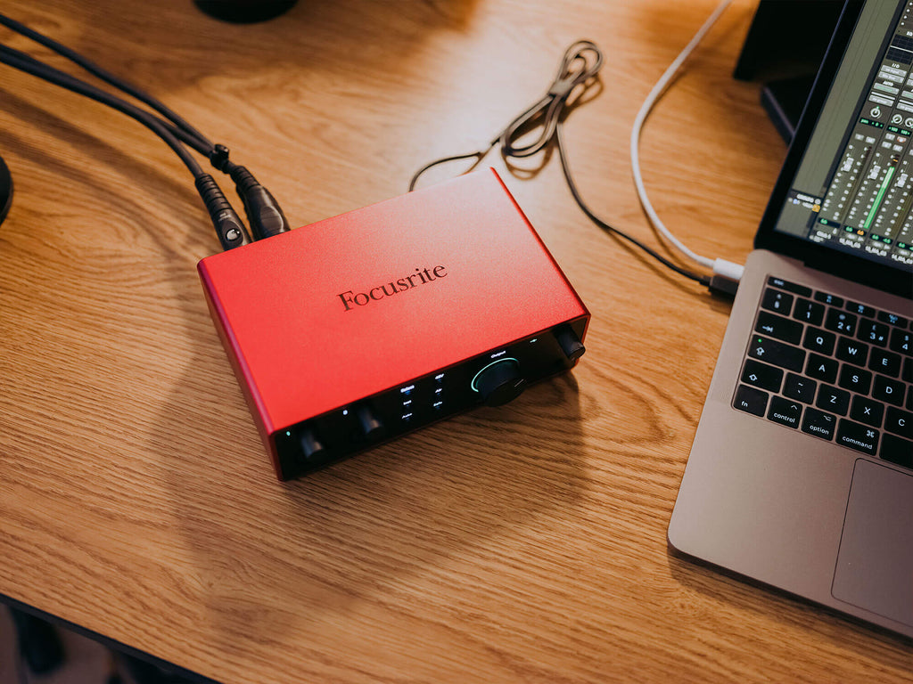 Focusrite Scarlett 4i4 4th Gen audio interface with multiple input and output ports, compact design, and professional-grade build.