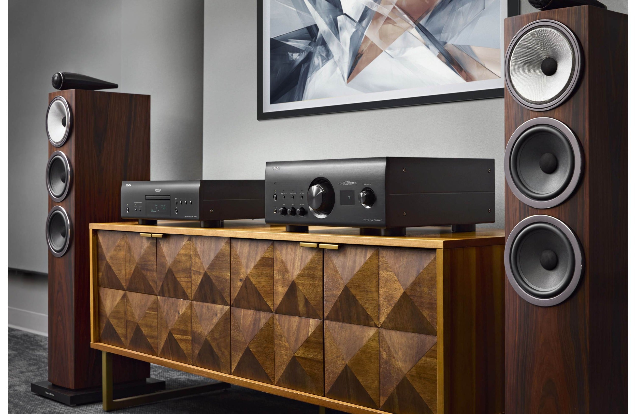 Denon DCD-3000NE CD player with sleek black finish and front-loading disc tray, showcasing modern audio equipment design.