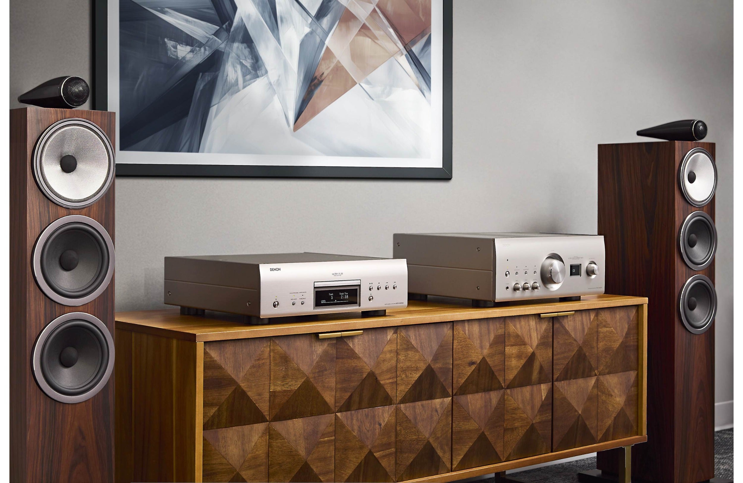 Denon DCD-3000NE CD player with sleek black finish and front-loading disc tray, displaying digital display and control buttons.