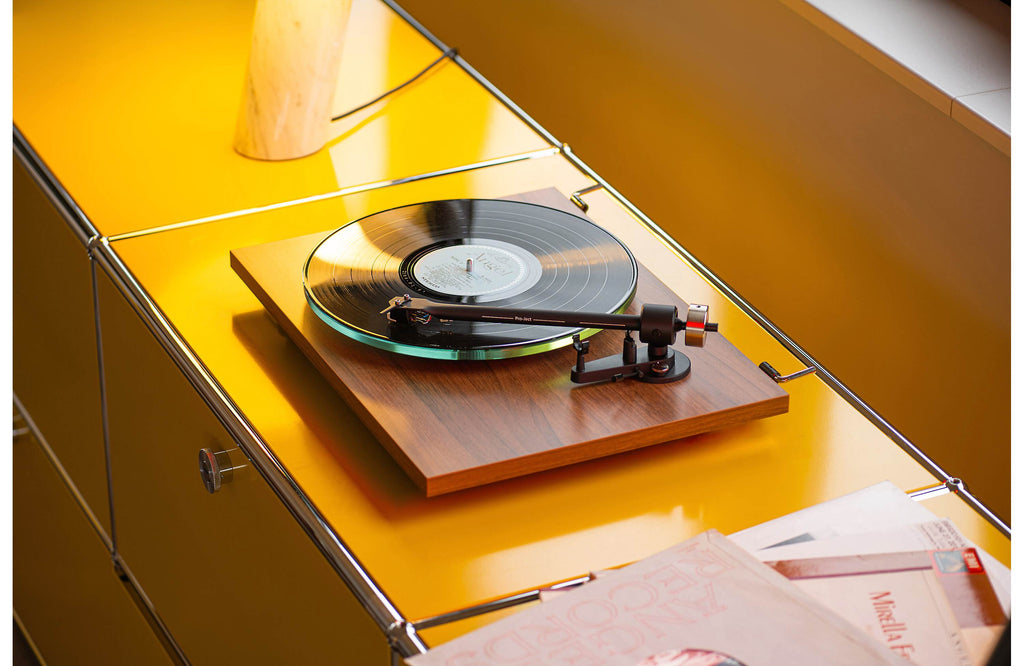 Pro-Ject T2 Super Phono turntable with sleek white finish, featuring tonearm and platter, designed for high-quality vinyl listening.