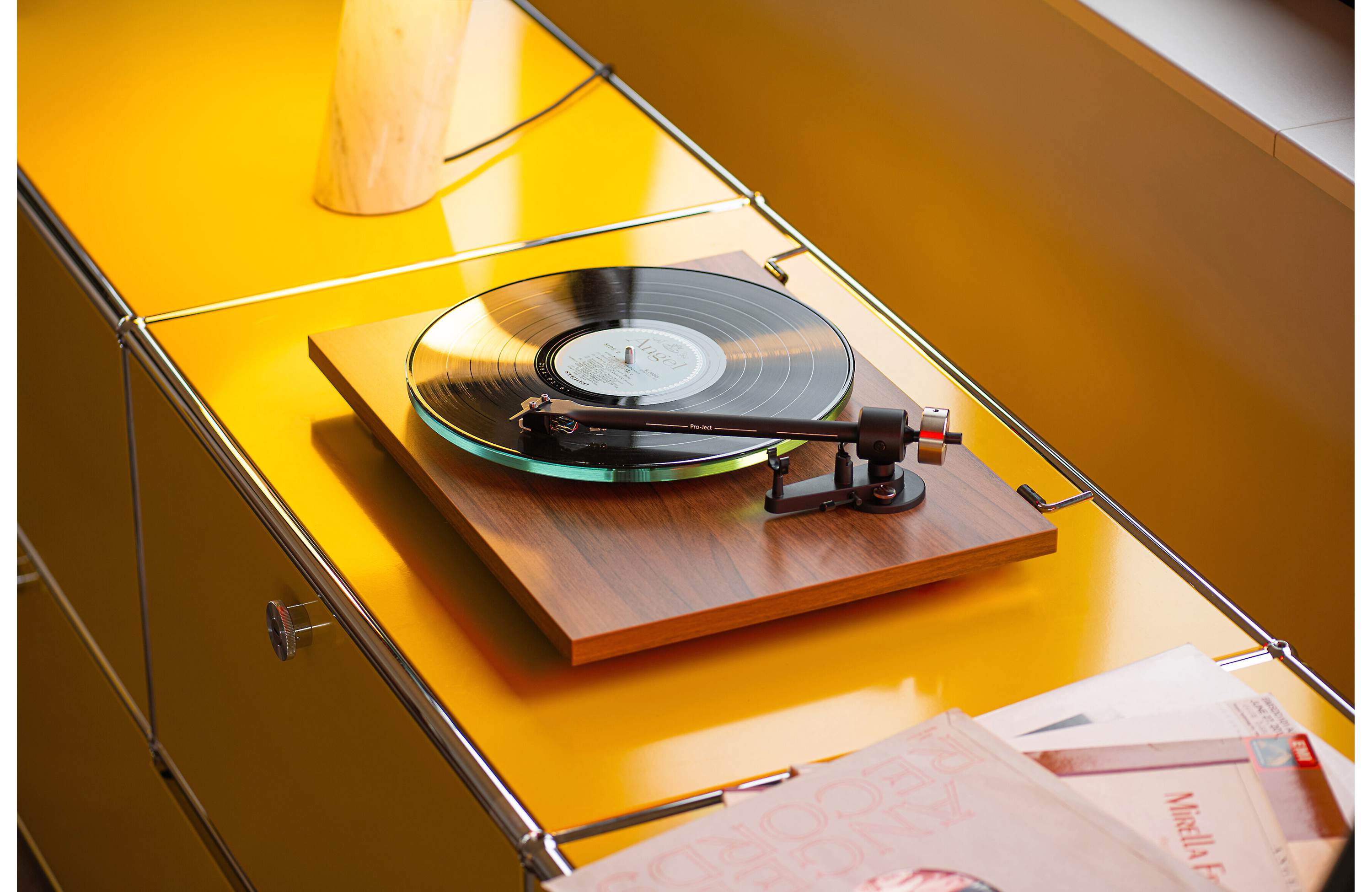 Pro-Ject T2 Super Phono turntable with sleek white finish, featuring tonearm and platter, designed for high-quality vinyl listening.