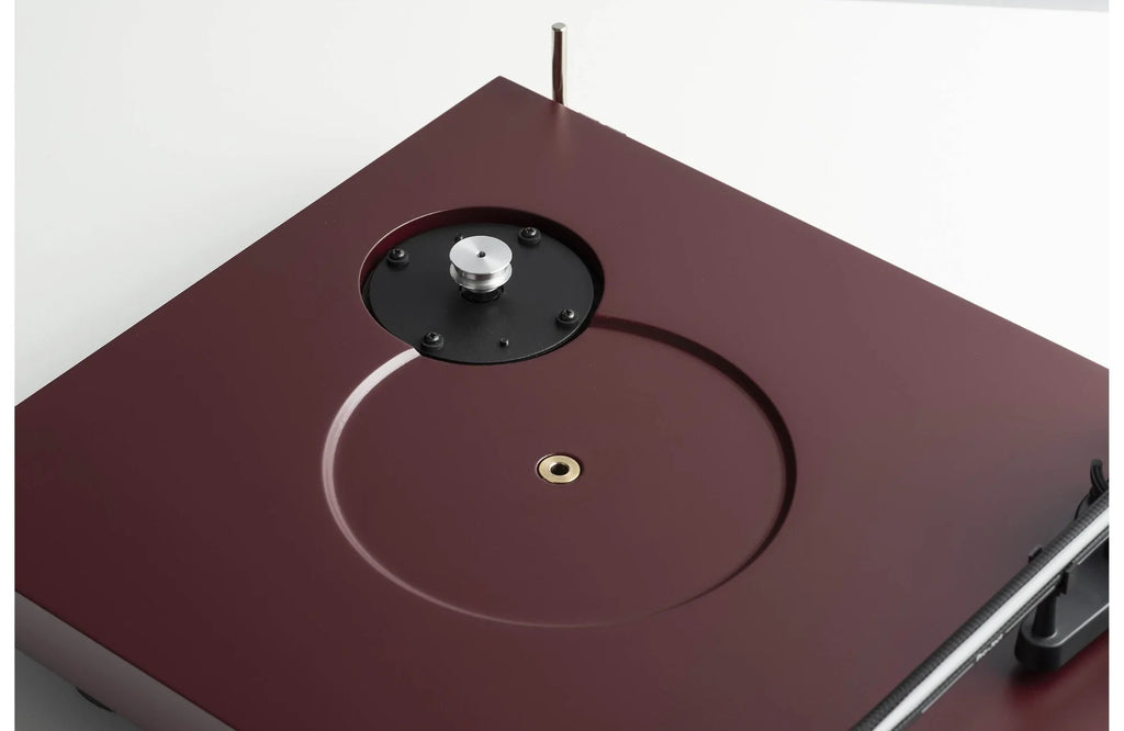 Pro-Ject Debut EVO 2 turntable with sleek design, black platter, and tonearm, showcasing high-quality audio equipment.