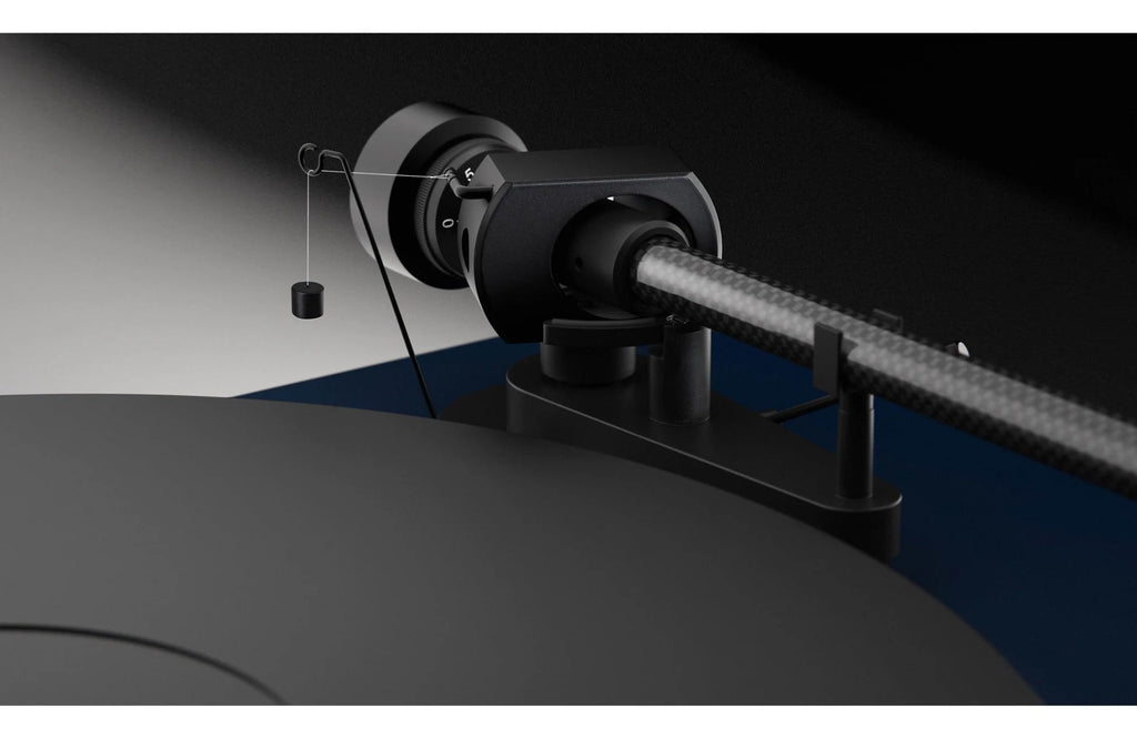 Pro-Ject Debut EVO 2 turntable with sleek black finish and modern design, featuring a tonearm and platter for high-quality vinyl playback.