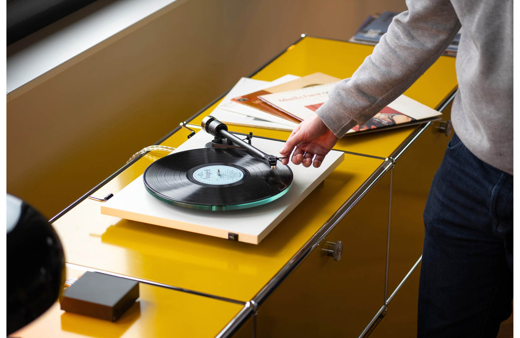 Pro-Ject T2 Super Phono turntable with sleek black finish, featuring tonearm and platter for high-quality vinyl playback.