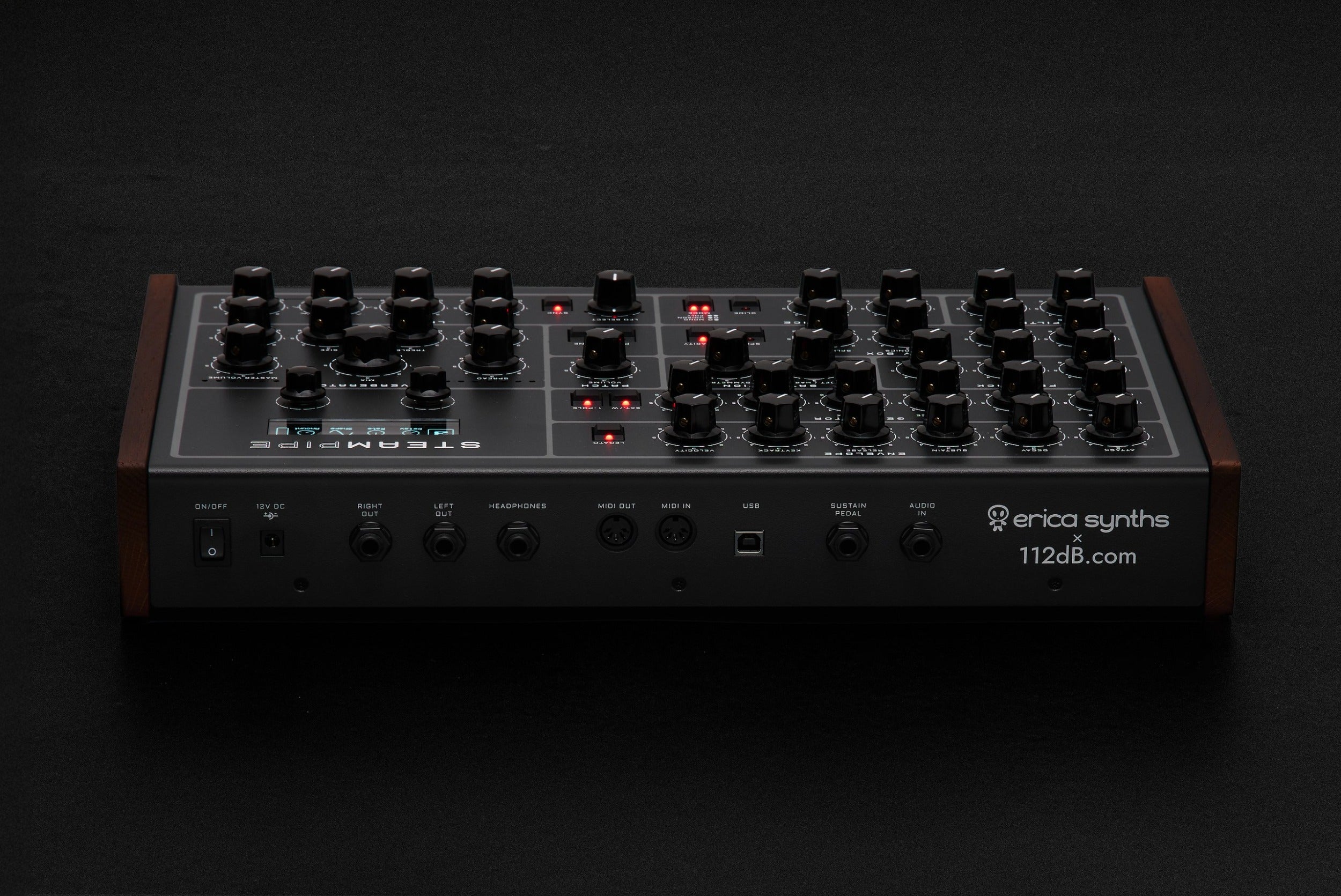 Erica Synths Steampipe desktop synthesizer with colorful knobs and patch points on a compact metal case.