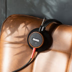 Wired Grado Signature S550 headphones with over-ear design and silver accents, shown from a side angle.