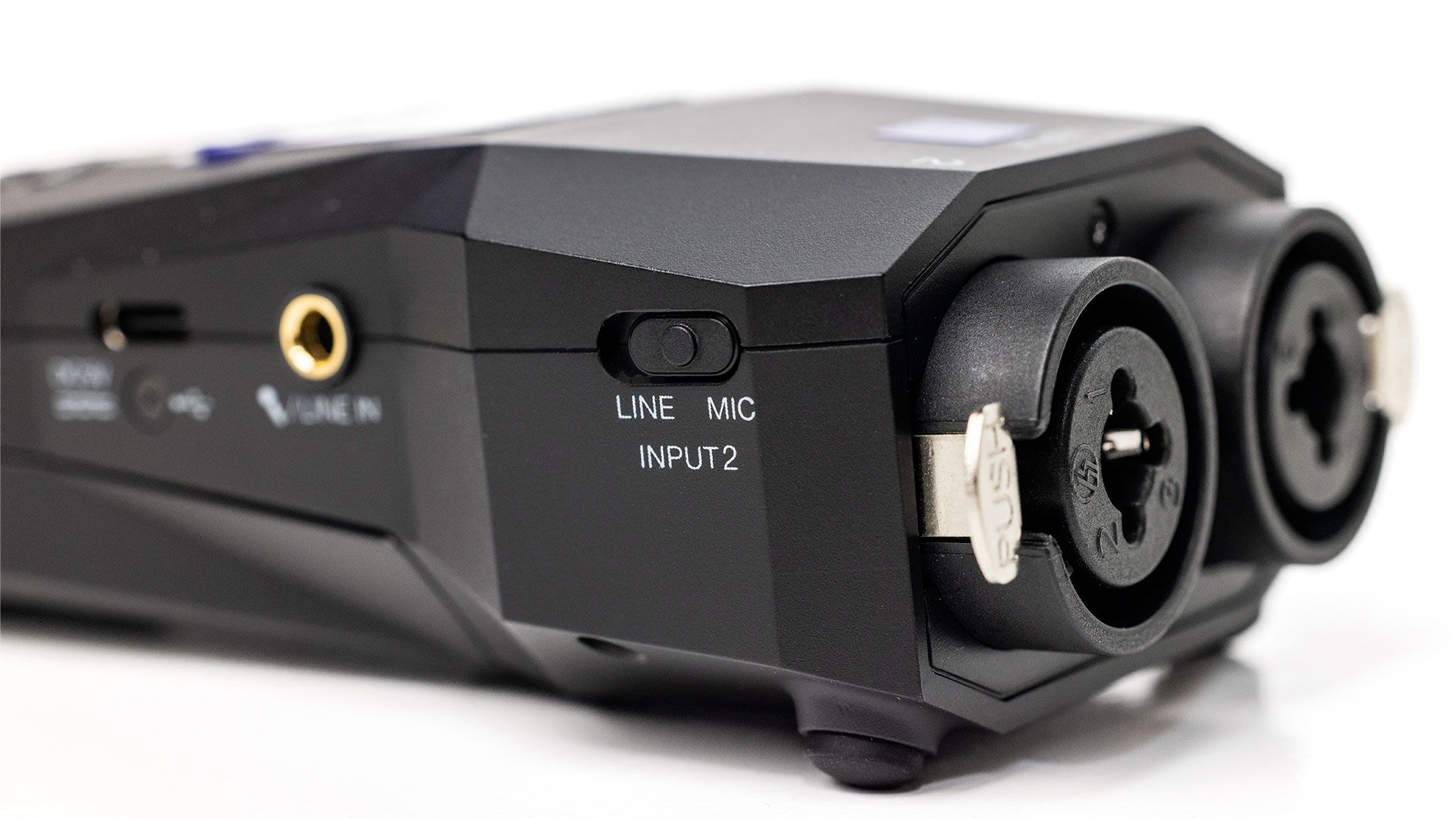 Zoom H1 XLR digital recorder with XLR input, compact design, and built-in microphones for high-quality audio recording.