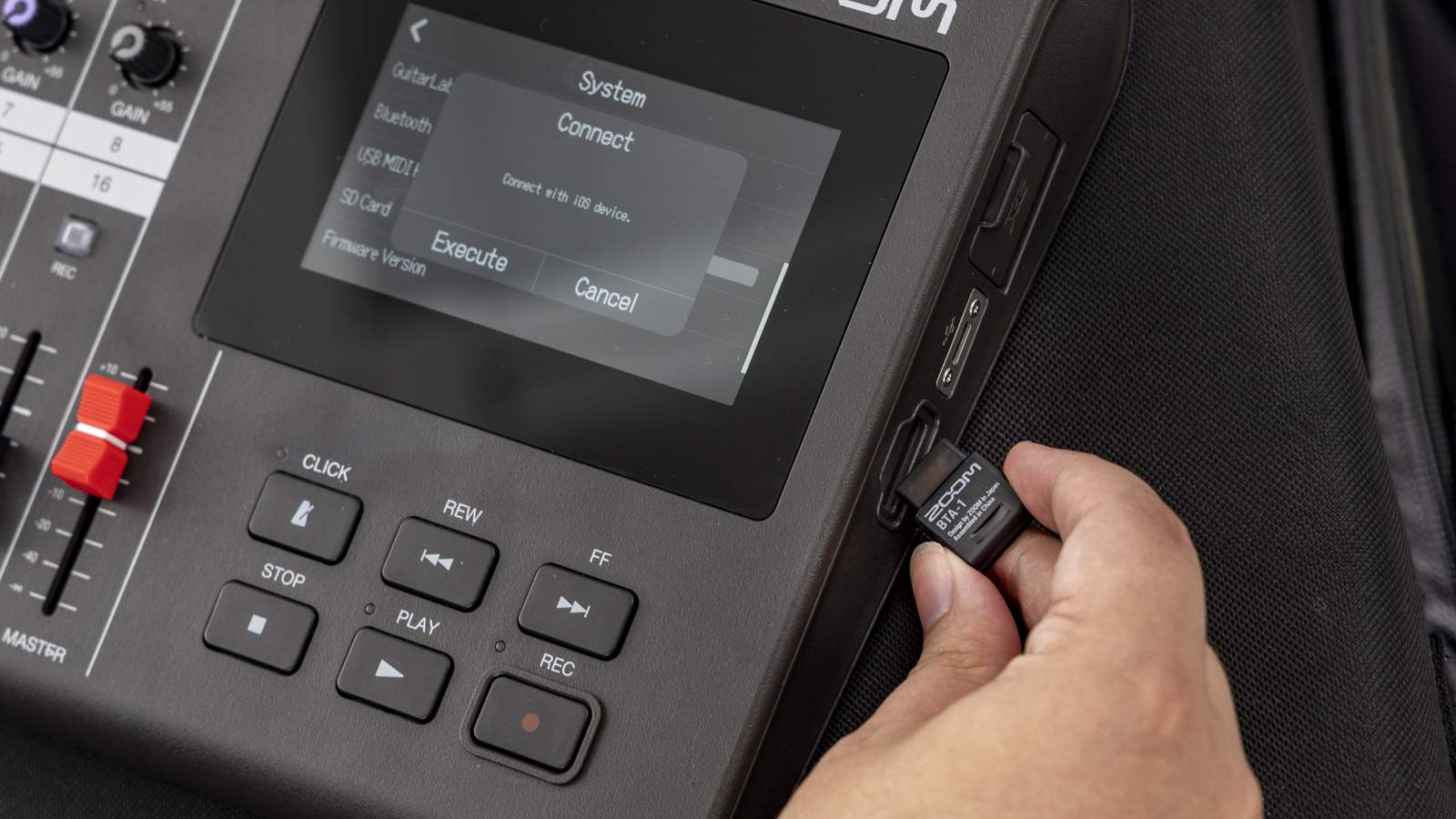 Zoom BTA-1 digital recorder with built-in microphone and controls, shown in a close-up image with a sleek design.