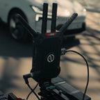 Hollyland Pyro Ultra transmitter mounted on a camera rig on set