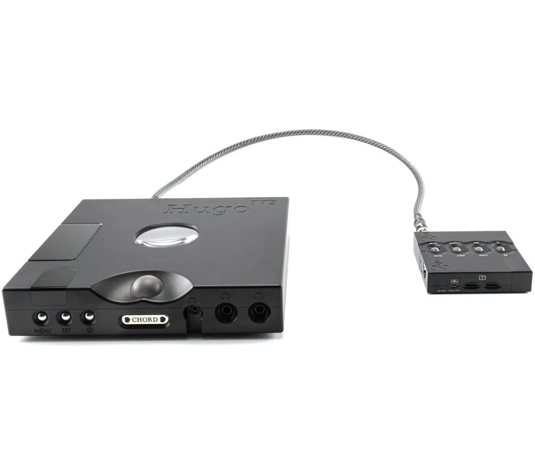 Chord Electronics Hugo TT2 headphone amplifier and DAC with sleek black design, multiple input ports, and digital display on front panel.