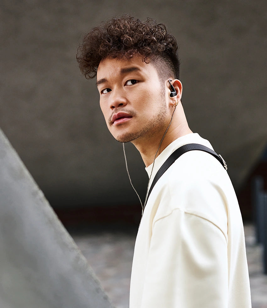 Wired Sennheiser IE 200 in-ear headphones with black earbuds and inline remote, designed for high-quality audio.