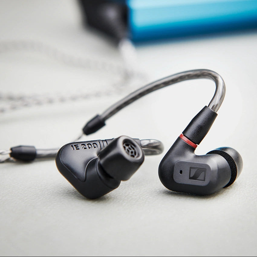 Sennheiser IE 200 wired in-ear headphones with black ear tips and sleek design, showcasing premium audio quality.