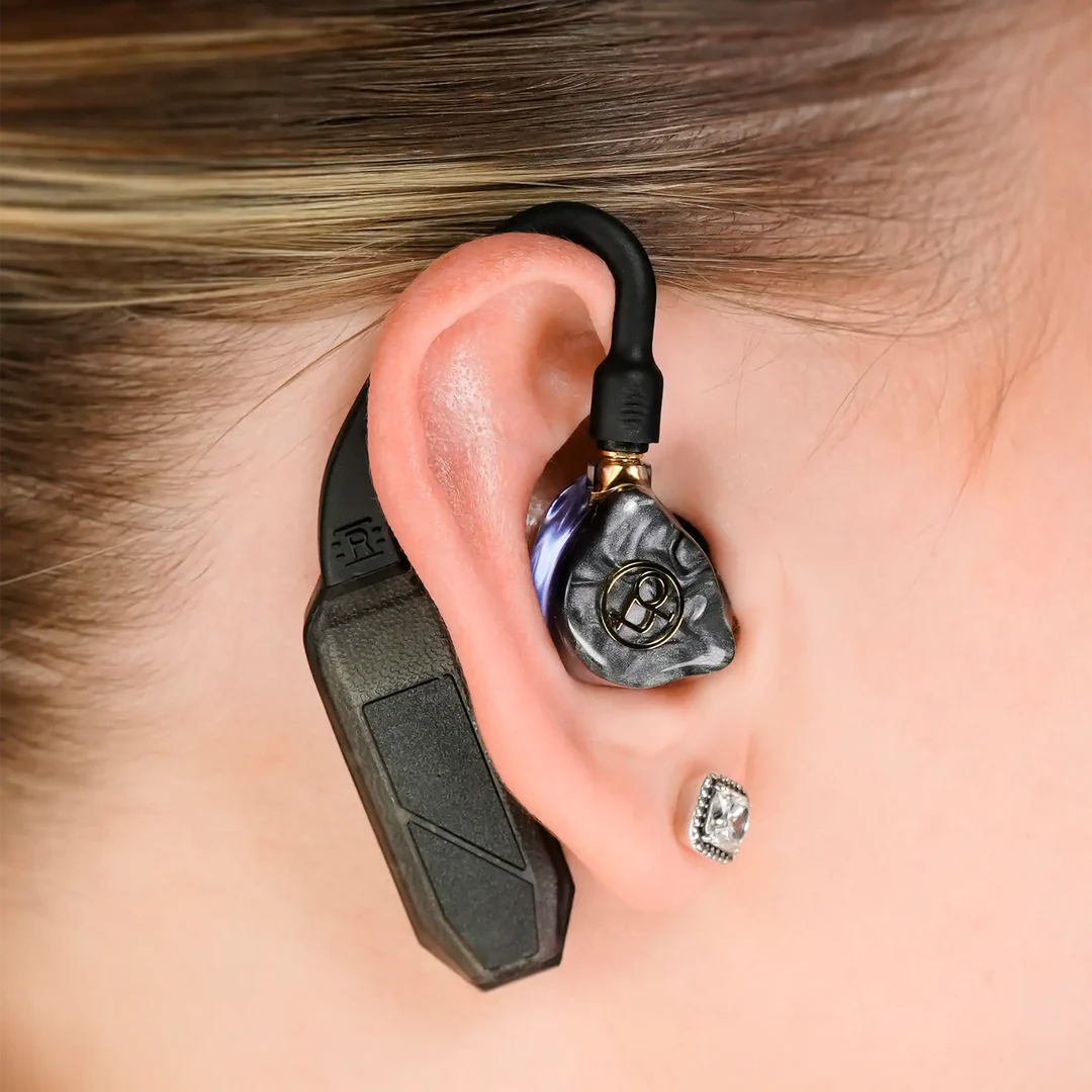 iFi Audio Go Pod Air headphone amplifier and DAC showing compact design with buttons and ports on the black device.