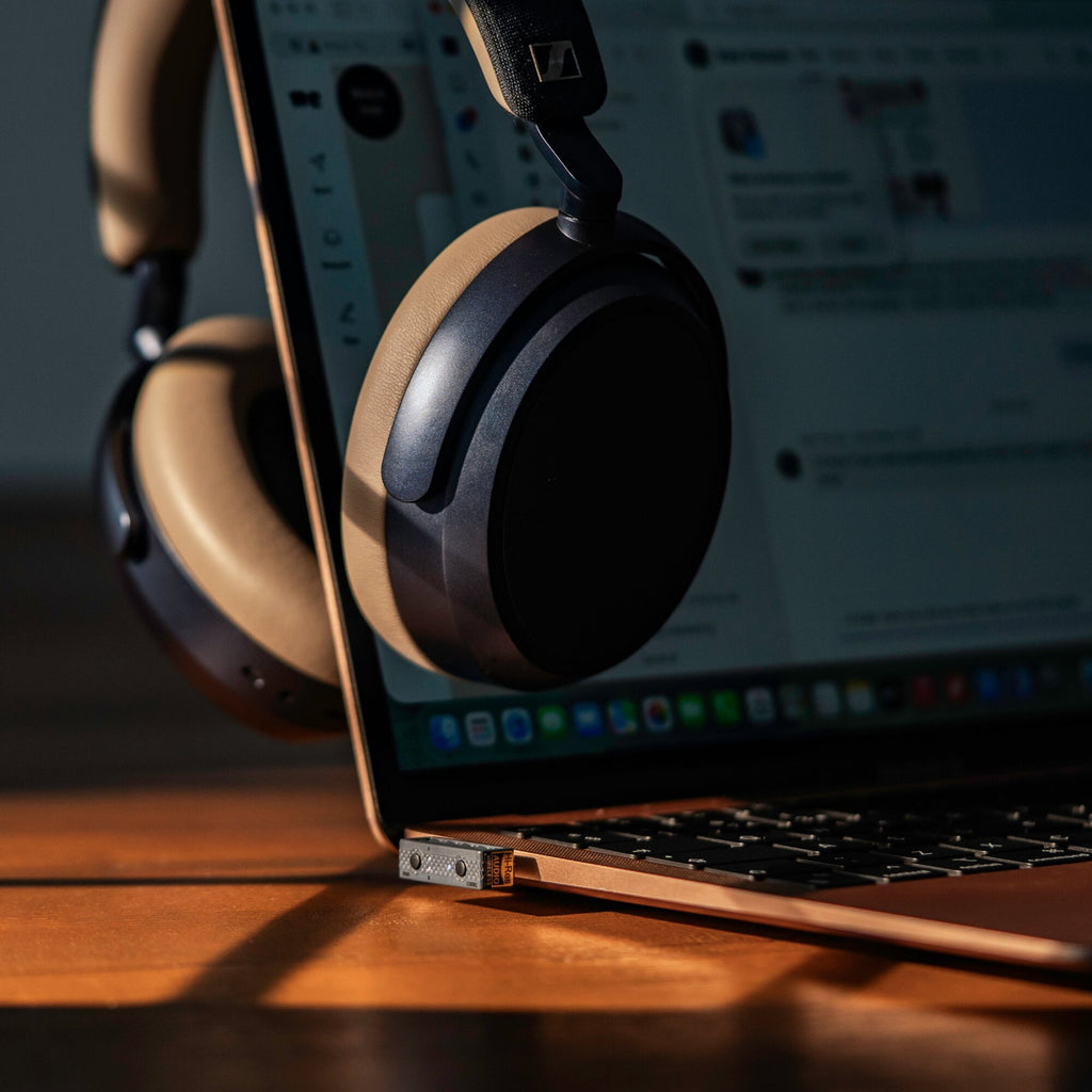 iFi Audio UP Play Max in a laptop USB-C port with wireless headphones