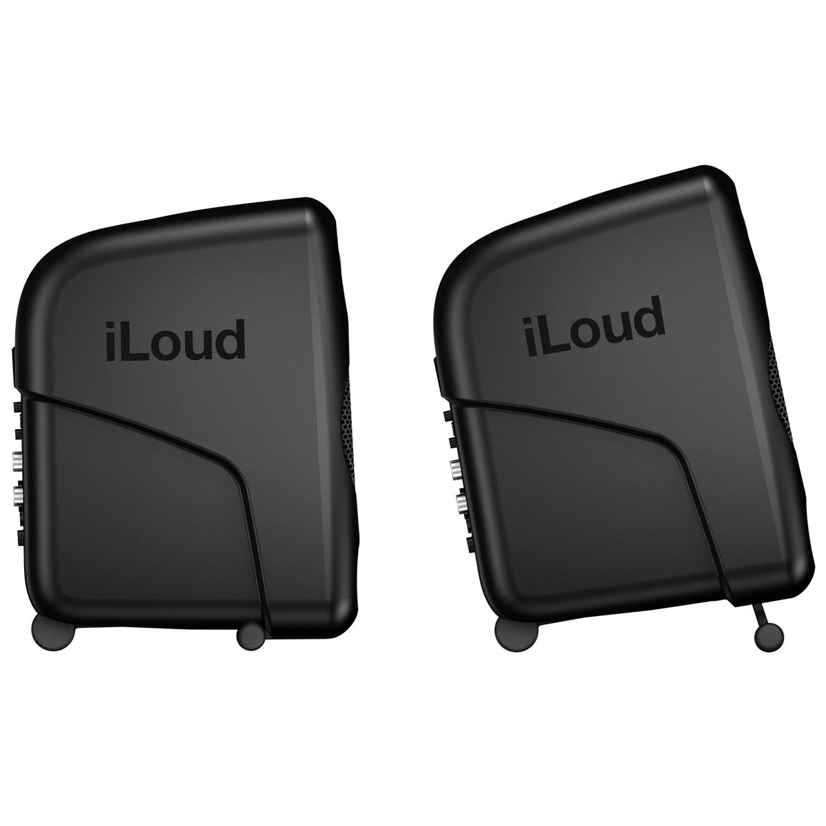 Pair of IK Multimedia iLoud Micro Monitors desktop speakers on a desk, showcasing compact professional audio speakers.