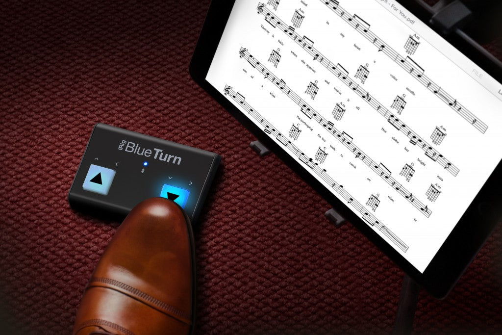 IK Multimedia iRig BlueTurn MIDI footswitch pedal with dual illuminated buttons for music control and performance.