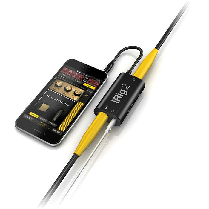 IK Multimedia iRig 2 audio interface with input and output jacks, compact design, used for mobile music recording and audio processing.