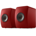 KEF LS50 Wireless II wireless speakers showing sleek black cabinets and modern design with speaker grilles.