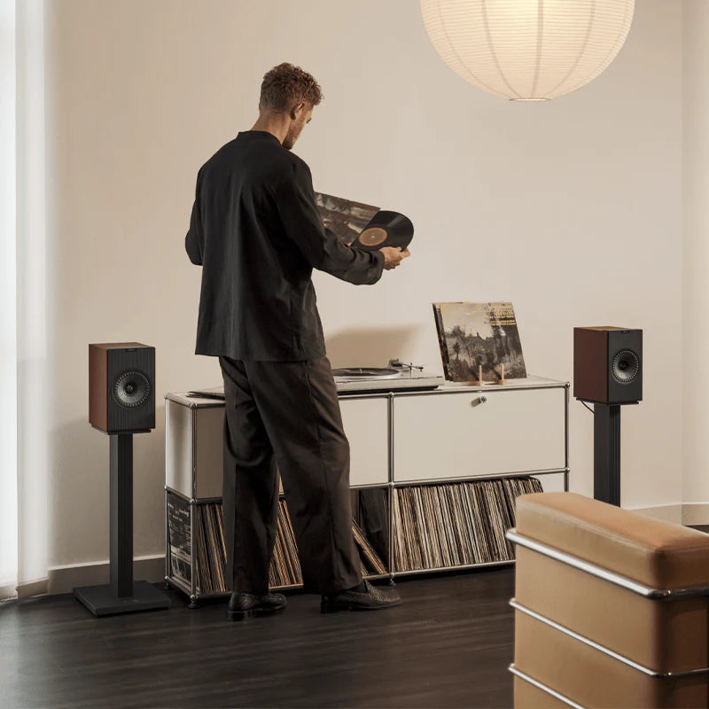 KEF Coda W active bookshelf speakers with sleek black finish and modern design, featuring front-facing drivers and compact form.