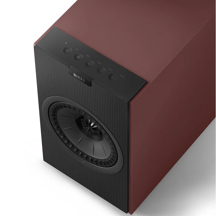 KEF Coda W active bookshelf speakers with sleek black finish and modern design, showing the front view with speaker grille and branding.
