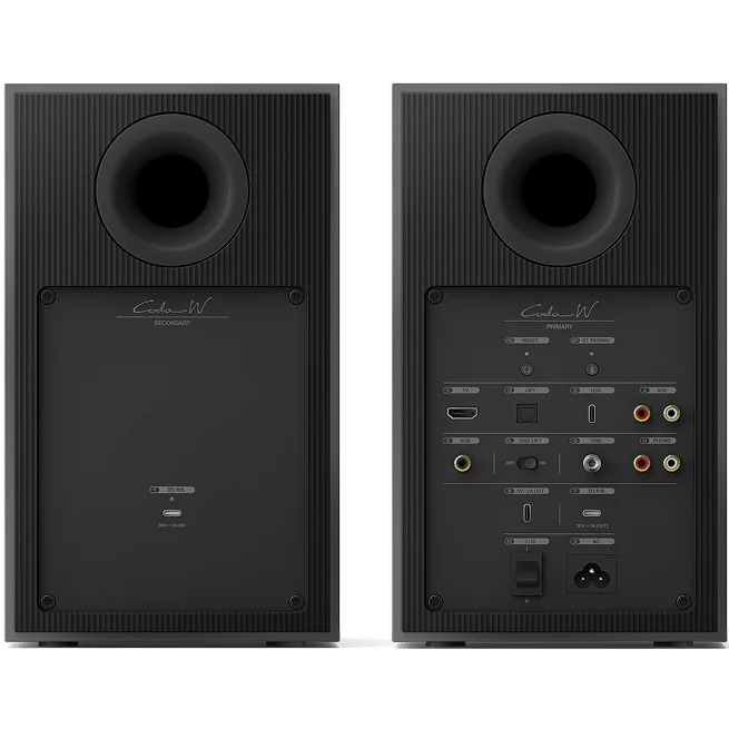 KEF Coda W active bookshelf speakers showing sleek black cabinets and front grille with drivers visible.