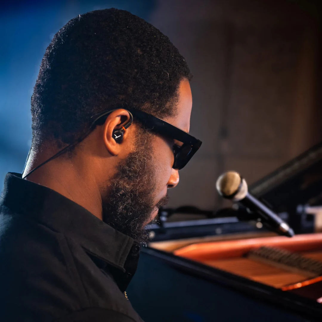 Beyerdynamic DT 70 IE studio in-ear headphones shown on stage for mixing and critical listening applications.