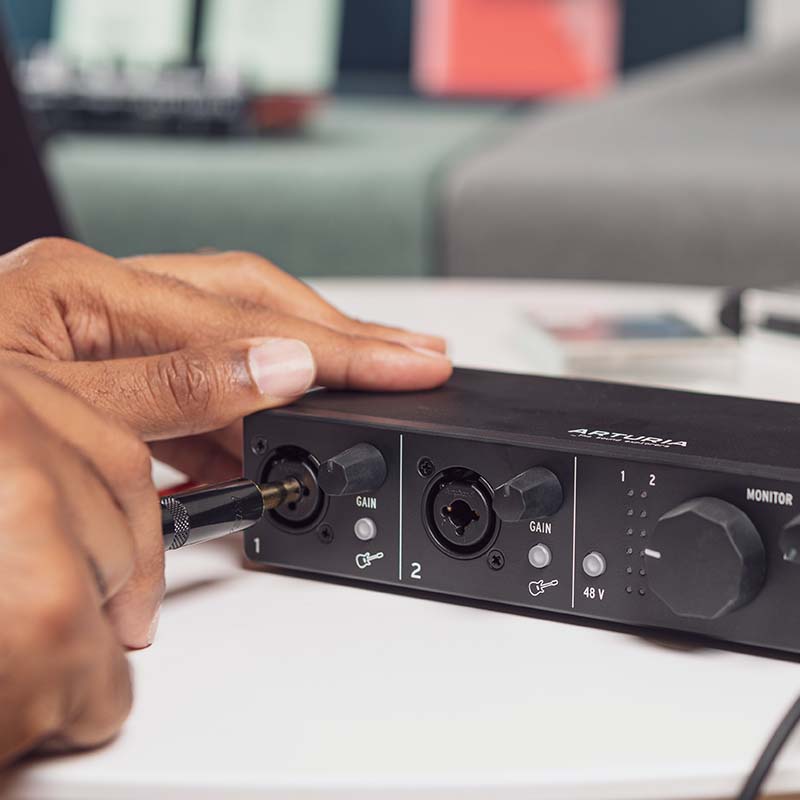 Arturia MiniFuse 1 audio interface with input and output ports, compact design, and professional audio connectivity.