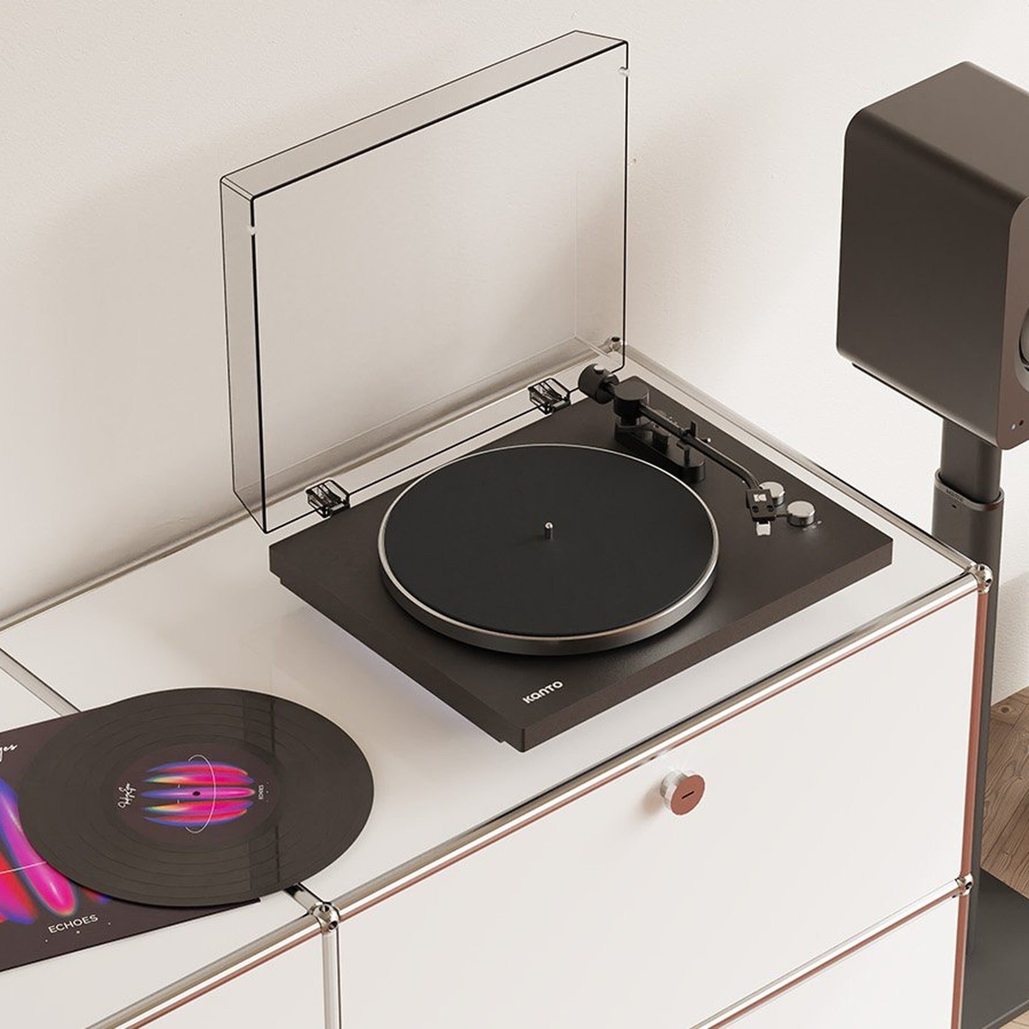 Kanto Audio OBI3 Gen 2 black belt-drive turntable on a white shelf with a vinyl record