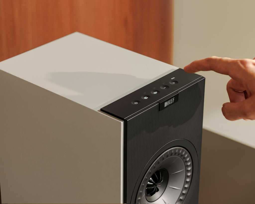 KEF Coda W active bookshelf speakers in gray, showcasing sleek design and compact size for high-quality audio.