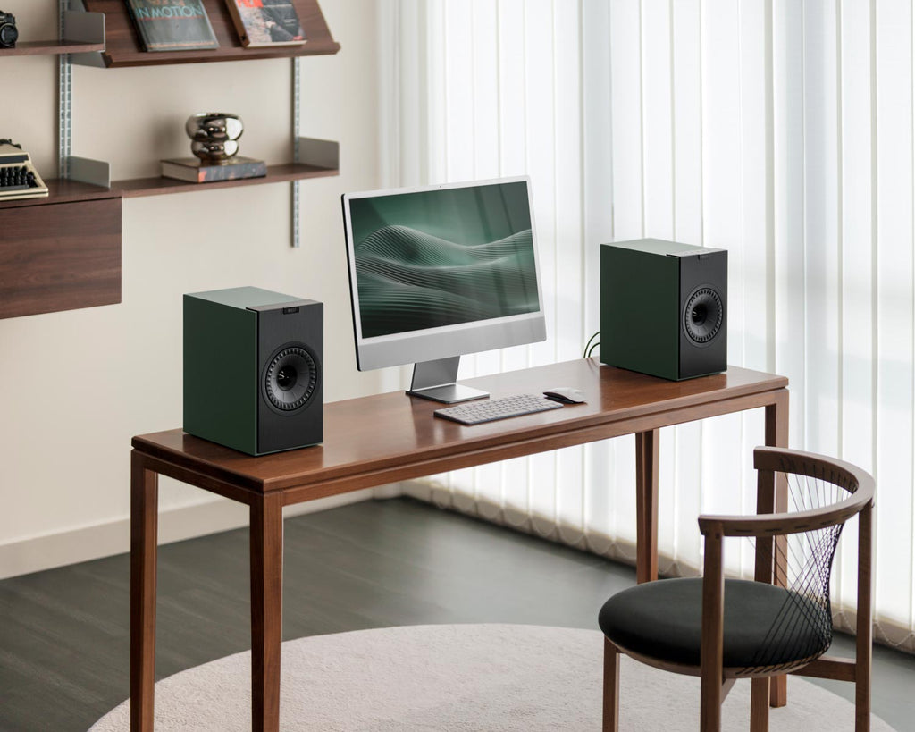 KEF Coda W active bookshelf speakers in green with sleek design and modern finish, showcasing high-quality audio and compact size.