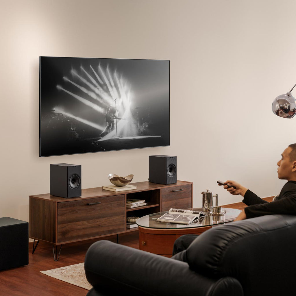 KEF Coda W active bookshelf speakers with sleek titanium finish, showcasing modern design and high-quality audio components.