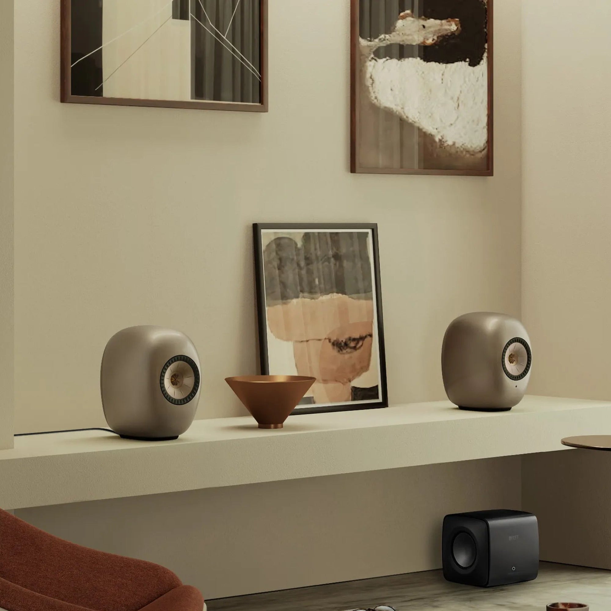 KEF LS Luxe in Dusk Titanium on a living room shelf
