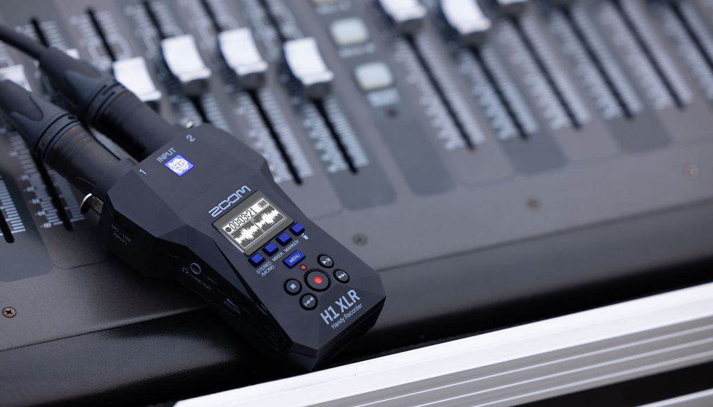Zoom H1 XLR digital recorder with XLR input, compact design, and professional audio recording features.