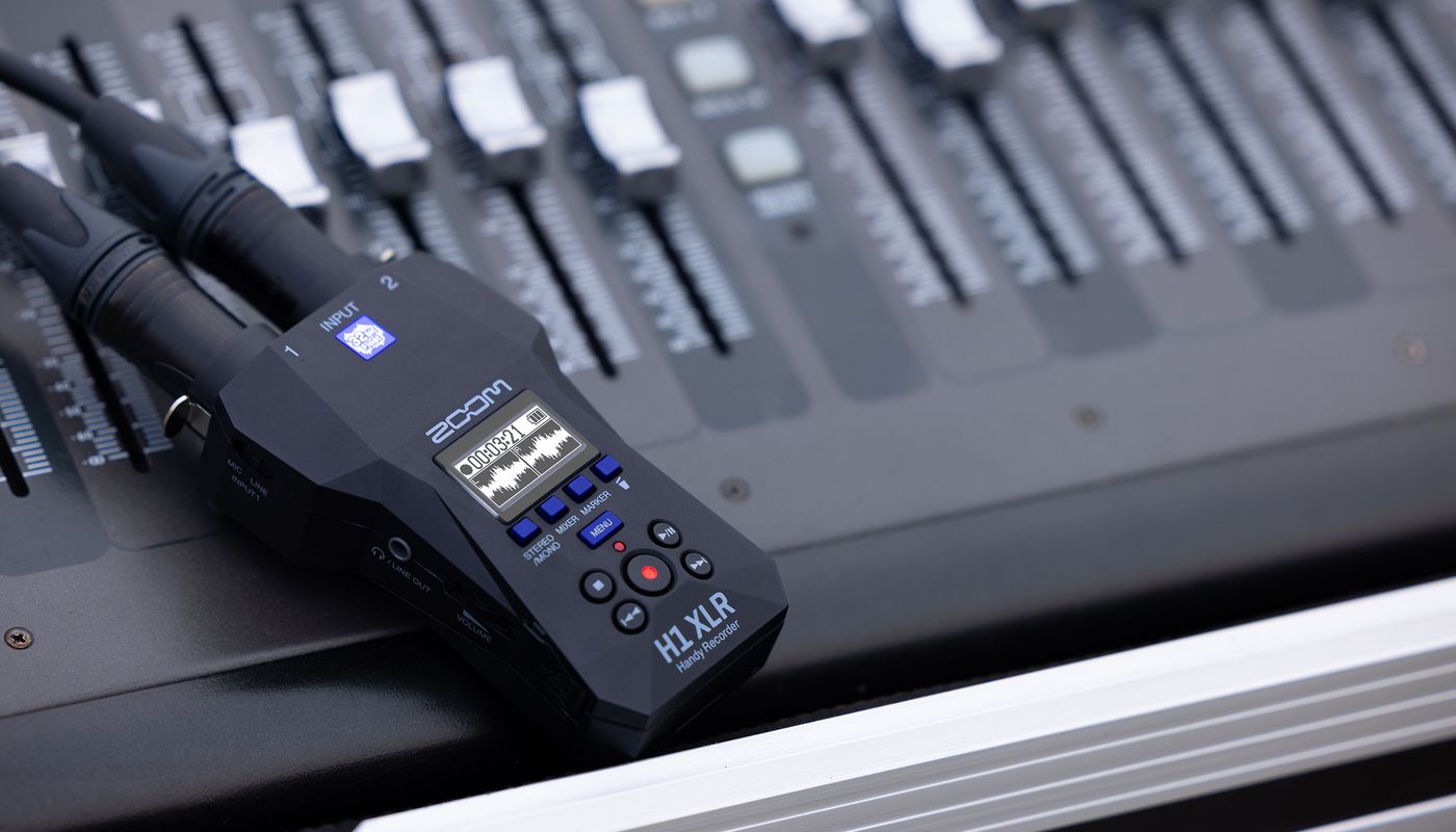 Zoom H1 XLR digital recorder with XLR input, compact design, and professional audio recording features.