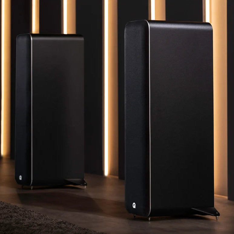 Q Acoustics M40 wireless speakers with sleek black cabinets and modern design, showing the front view of the speakers.