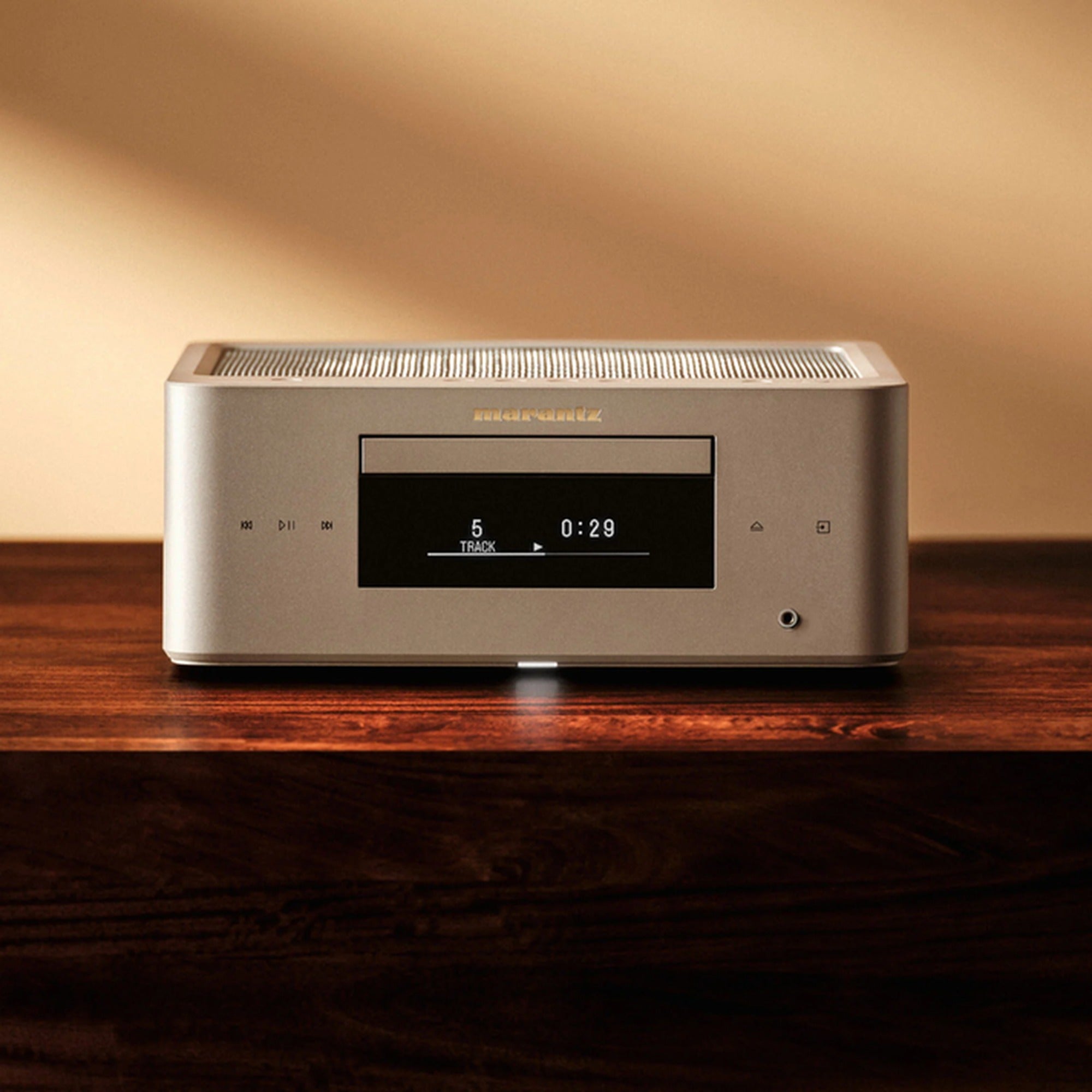 Marantz MCR 60n DAB in Marantz Champagne Gold on a dark wood shelf