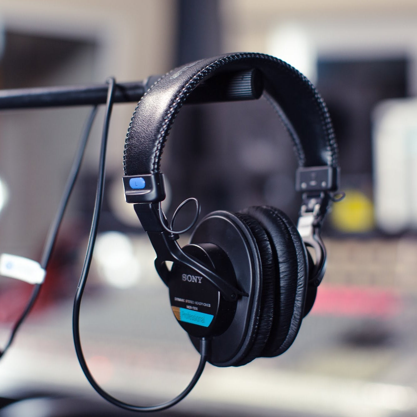 Sony MDR-7506 studio headphones with over-ear design, black color, and adjustable headband for professional audio monitoring.