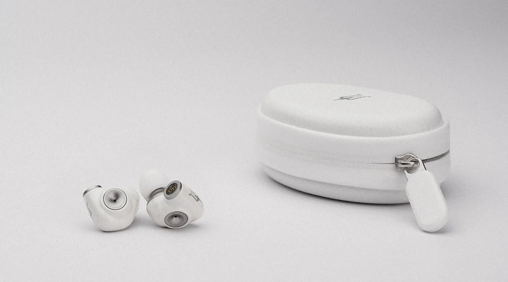 Meze Audio Alba in-ear headphones with black earbuds and silver accents, shown from a side angle against a white background.