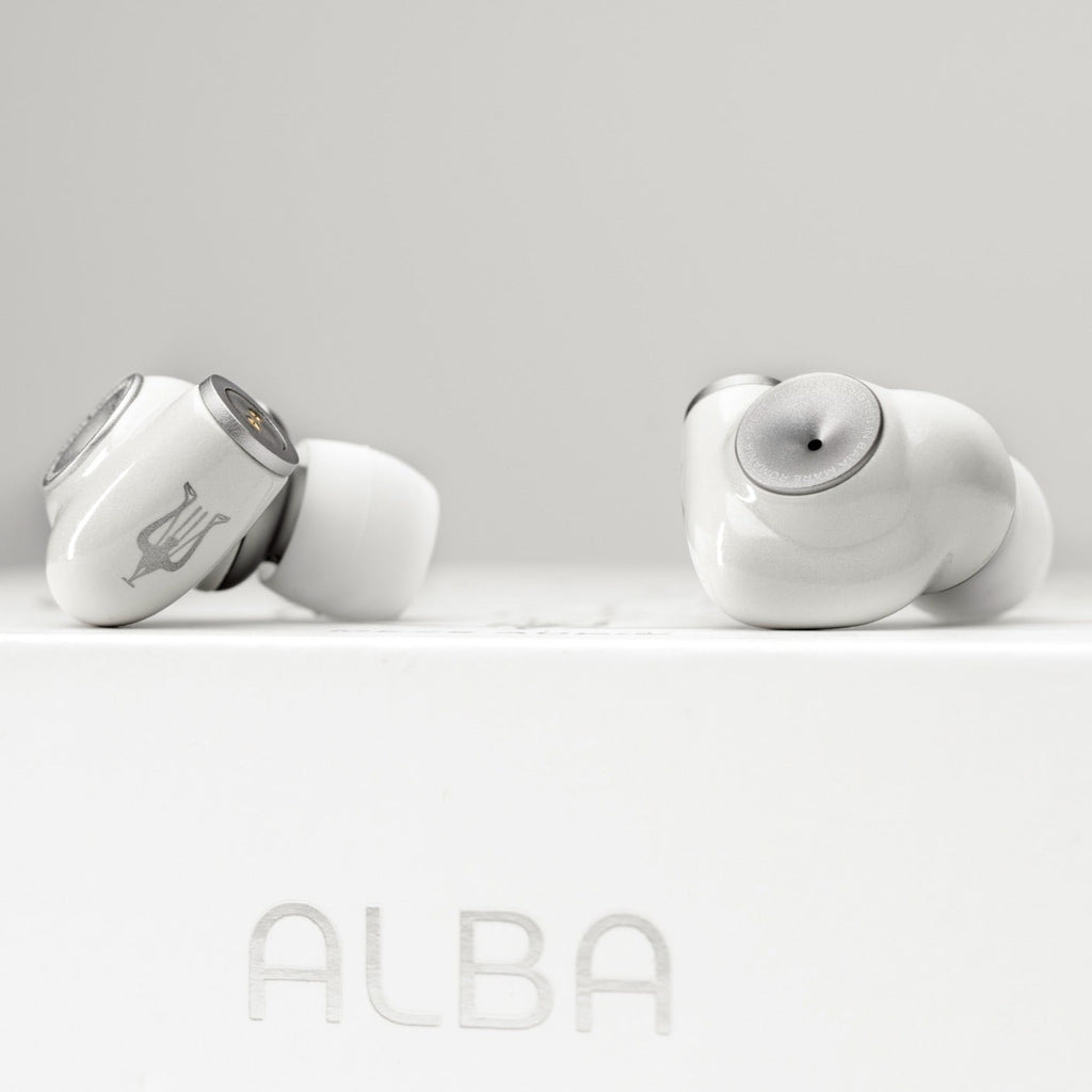 Meze Audio Alba in-ear headphones with sleek black design and silver accents, displayed on a white background.