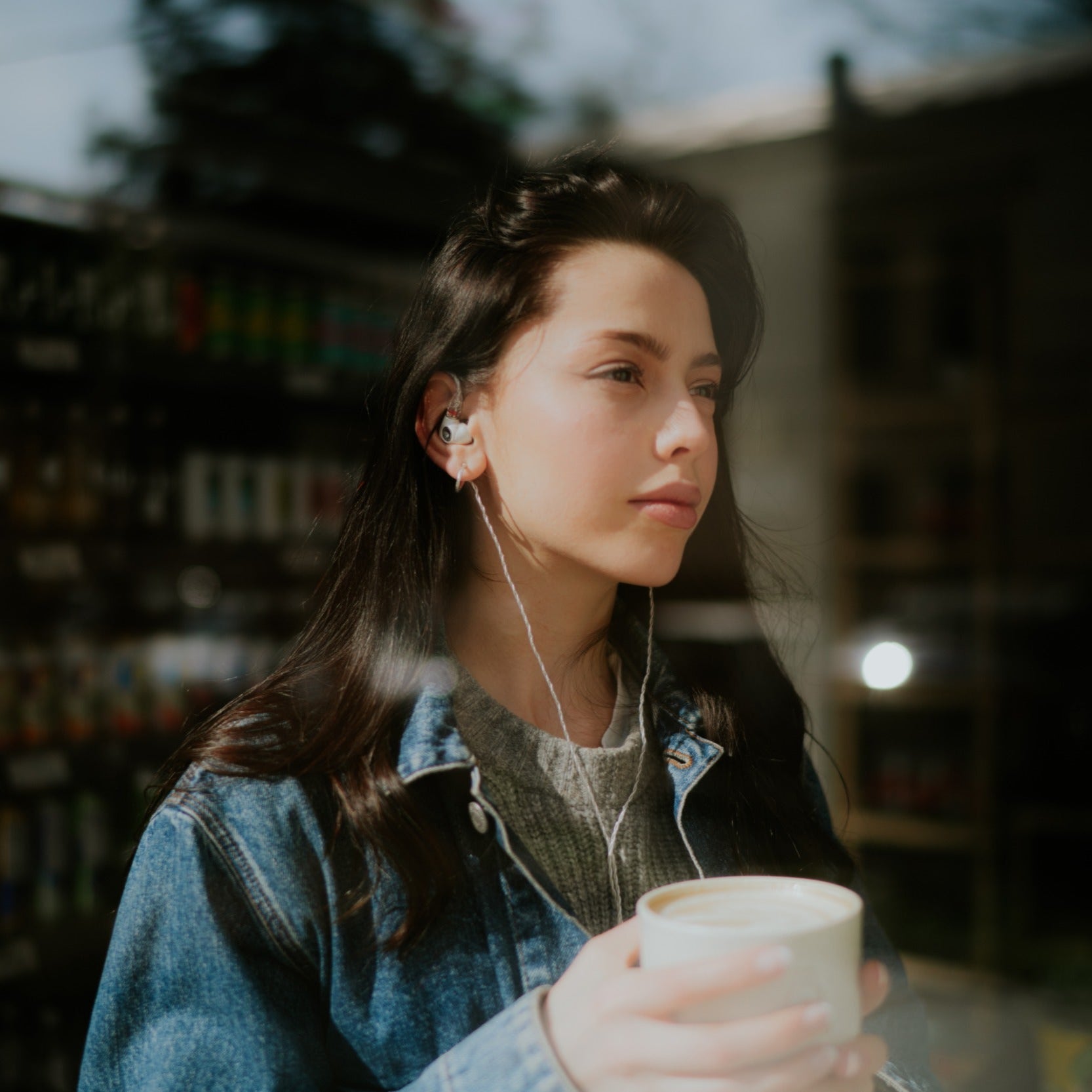 Meze Audio Alba in-ear headphones with sleek black design, featuring ergonomic earbuds and audio cables.
