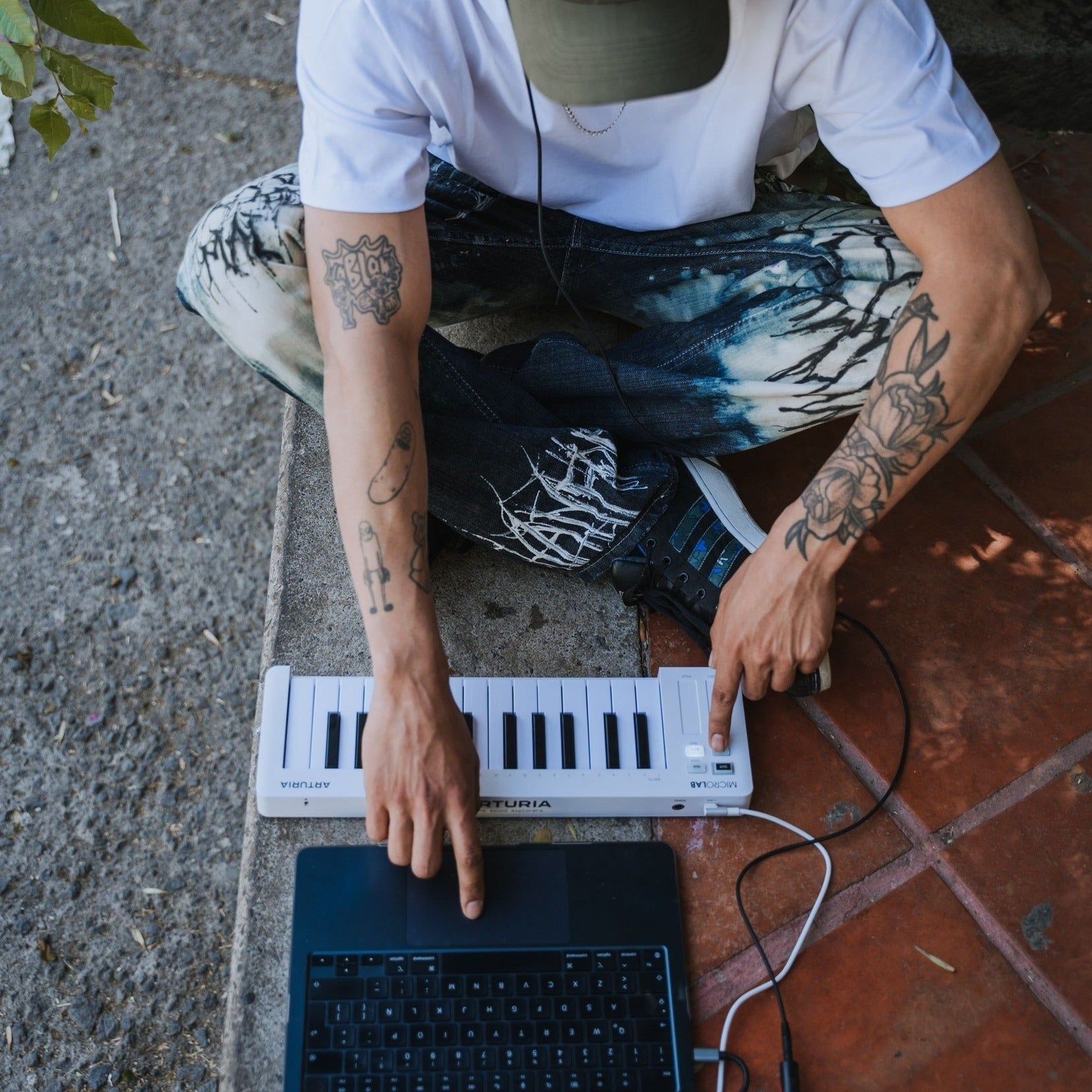Arturia MicroLab MK3 MIDI keyboard with compact design, black keys, and control knobs for music production and performance.